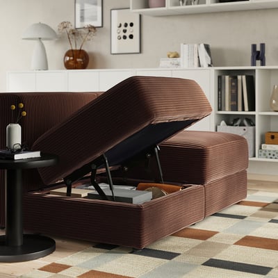 Brown modular sofa, JÄTTEBO, with open storage. Shows gas spring dampers and storage space under seat.