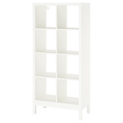 A white KALLAX shelving unit with multiple open shelves and a metal underframe. It has a modern design with clean lines.