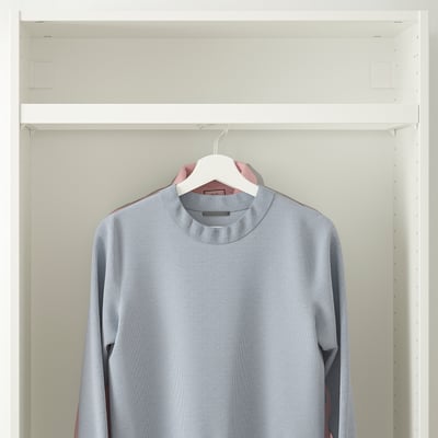 A light gray sweater hangs in a wardrobe on a white clothes rail, showcasing its neat organization and storage functionality in a shallow frame.