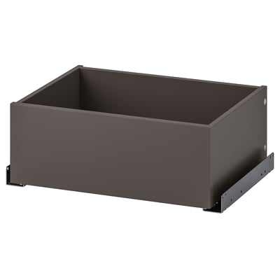 An ikea KOMPLEMENT drawer in grey. Its rectangular with sleek lines and minimalist design, ideal for wardrobe storage.