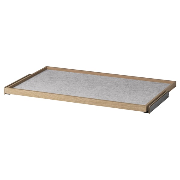 An oak-framed pull-out shelf with grey felt lining, designed for wardrobe organization.