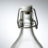 Glass bottle with sturdy metal clasp and tight seal ensuring freshness.