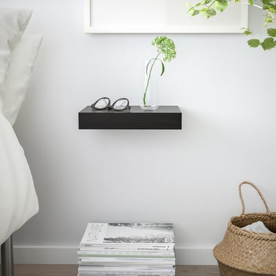 Gray LACK wall shelf with vase, glasses, books, and basket.