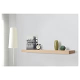 Wooden wall shelf displaying clock, photo, and two decorative cacti with hidden support brackets.