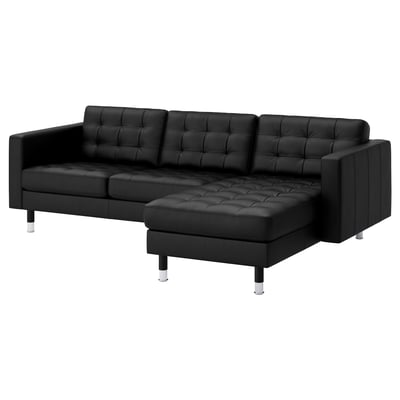 Black l-shaped leather sofa with chrome legs.