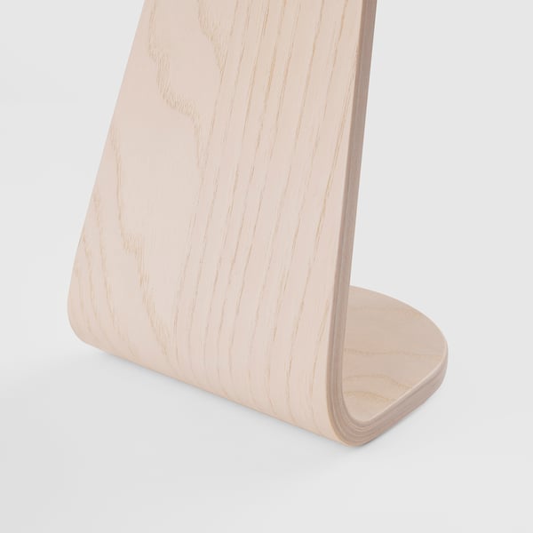 Wooden headphone stand, veneer, sleek design, sturdy, organizes headphones.