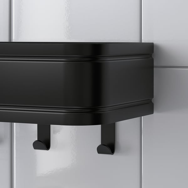 Black metal shelf and hook combo; modern, sturdy design. Keeps items secure on ledge. Perfect for bathroom storage.