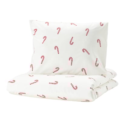 White duvet set with red candy cane print, soft cotton, holiday-themed.