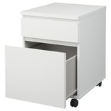 White mobile storage unit with one open drawer on casters for easy movement.