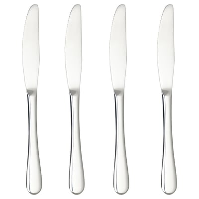 Four silver stainless steel knives in a row, sleek design, uniform style.