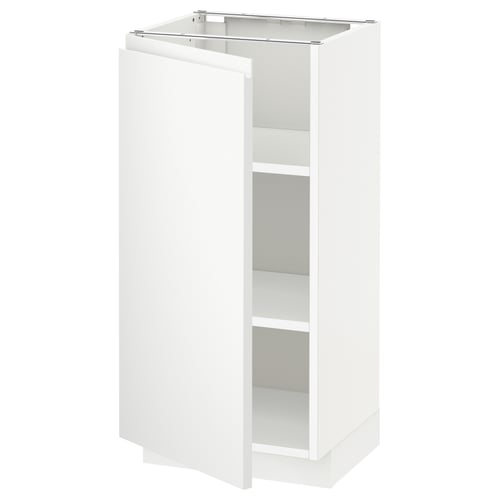 A white METOD kitchen cabinet with a minimalist design and adjustable shelves. It a modern, clean aesthetic with no visible handles.
