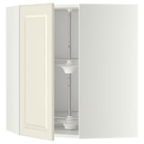 An open off-white METOD kitchen corner cabinet with an adjustable glass shelf and a central carousel pole.