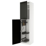 A white METOD kitchen cabinet with black bodbyn doors, featuring pull-out organizers inside.