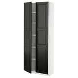 A tall white METOD cabinet with black bodbyn doors, featuring beveled edges and adjustable shelves.