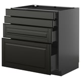 A black METOD kitchen cabinet with multiple drawers. It sleek, modern design with beveled edges and smooth-running drawers.