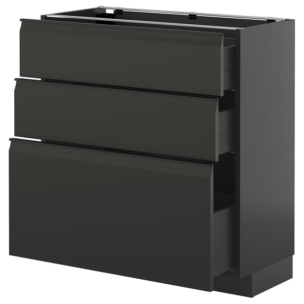 Modern black ikea METOD kitchen cabinet with three integrated handle drawers.