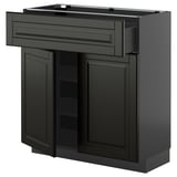 Black METOD kitchen cabinet with beveled bodbyn fronts, featuring doors and drawers. Modern, sleek design with soft-close drawers.