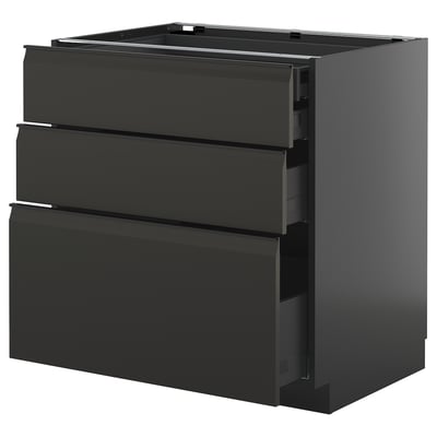 Modern black kitchen cabinet with smooth handles and multiple drawers.