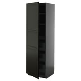 Image shows a tall, sleek black kitchen cabinet from the METOD system, featuring two doors and two shelves.