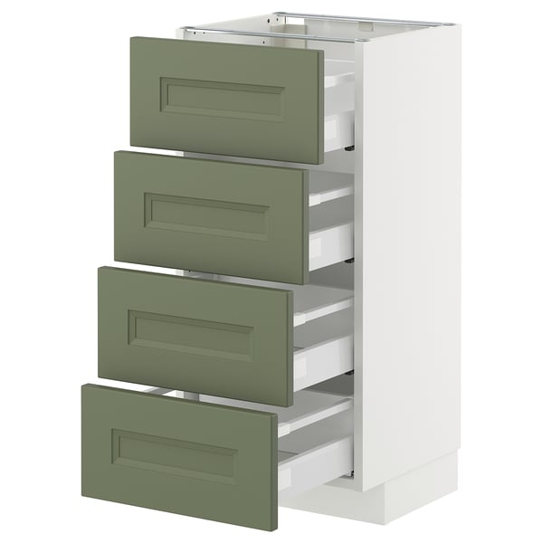 A white METOD kitchen cabinet with four green drawers, each equipped with smooth runners and a self-closing mechanism.