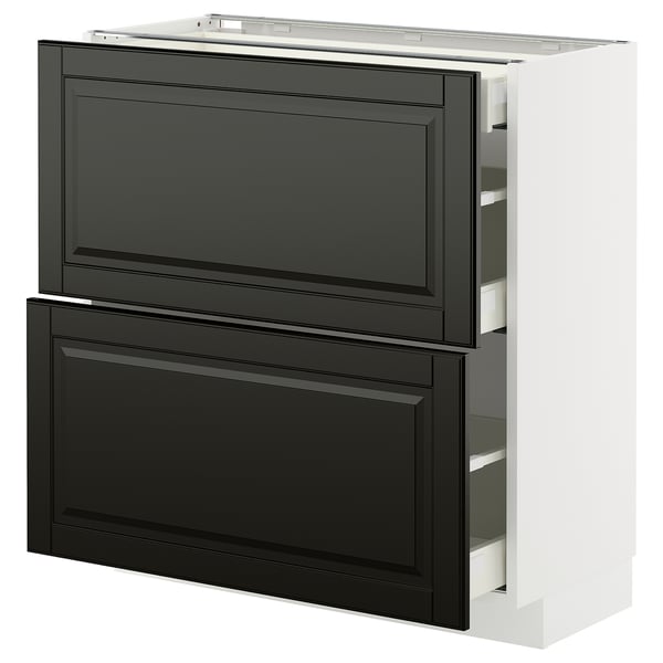Modern kitchen unit with black drawer fronts and bevelled edges on a white base.