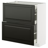 Modern kitchen unit with black drawer fronts and bevelled edges on a white base.