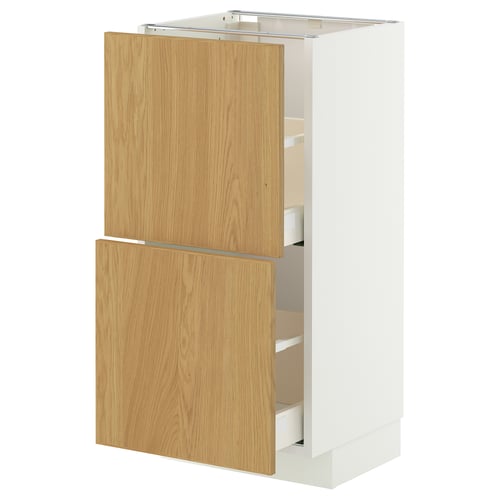 A white METOD cabinet with wooden drawers. It has two drawers and two doors, featuring a modern design.