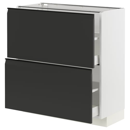 Modern kitchen cabinet in black with white frame, sleek design, self-closing drawers.