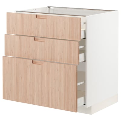 METOD kitchen unit with light bamboo drawers and white frame. Three drawers, sleek design.
