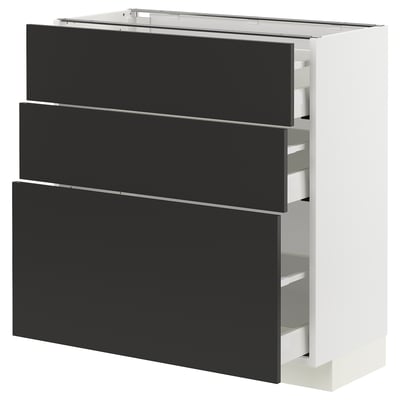 Modern white METOD cabinet with 3 sleek black drawers and metallic handles.