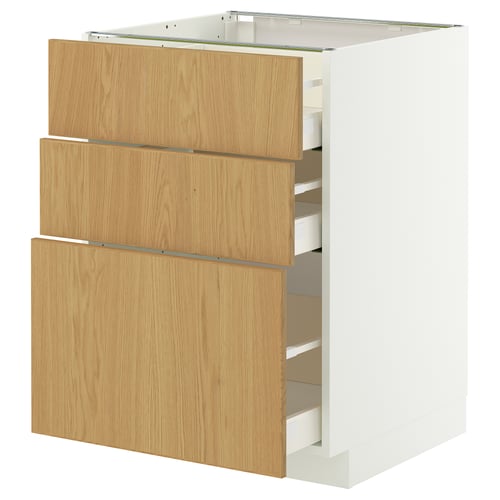 A white METOD kitchen cabinet with three light oak drawers.