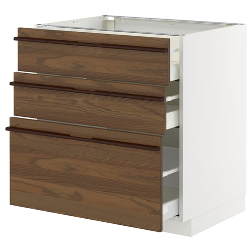 White METOD kitchen cabinet with dark brown drawers.