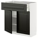 Black & white kitchen cabinet, modern design, dark drawer and doors, white frame, durable material.