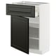 A METOD kitchen unit with a black beveled door and a matching drawer, framed in white. It has shelves for storage and a sleek, modern design.