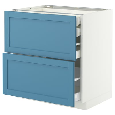White METOD kitchen cabinet with blue drawers, sleek design, self-closing drawers.