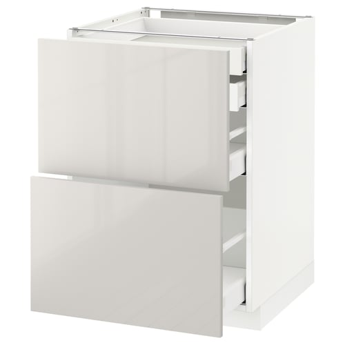 White METOD kitchen cabinet with glossy drawers and sleek modern design.