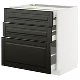 Modern black drawers on white cabinet. Sleek, rectangular shapes with beveled edges.