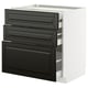 Modern black drawers on white cabinet. Sleek, rectangular shapes with beveled edges.