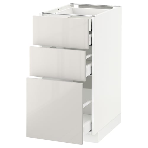 A white METOD kitchen cabinet with three drawers. It has a modern high-gloss finish and sturdy design.
