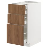 An open, white METOD kitchen cabinet with three wooden drawers.