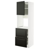 A white METOD kitchen cabinet with black bodbyn doors and drawers, featuring a sleek, modern design.