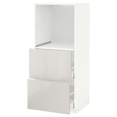 A white METOD kitchen cabinet with a glossy finish, featuring a partially open drawer and adjustable shelf.