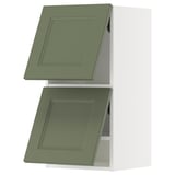 Green kitchen wall unit with two square doors and modern design.