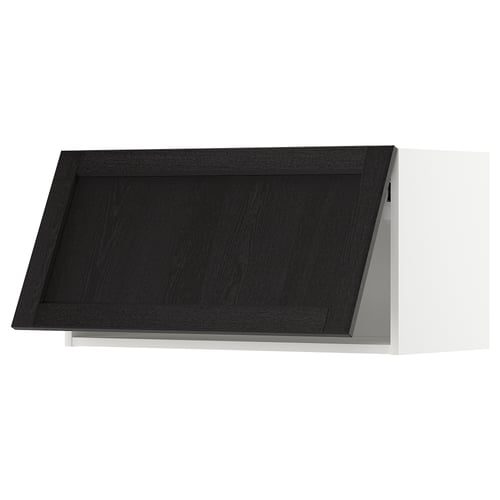 Modern black kitchen cabinet with bevelled edges and white frame.