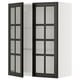 Modern black glass-door cabinet with beveled edges, offering a sleek, sophisticated look for organizing and displaying items.