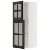 This image shows a white METOD kitchen cabinet with black bodbyn glass doors featuring beveled edges and a sleek design.
