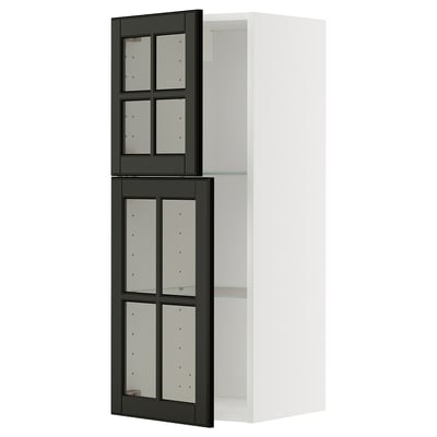 This image shows a white METOD kitchen cabinet with black bodbyn glass doors featuring beveled edges and a sleek design.