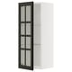 This image shows a white METOD wall cabinet with black glass doors, featuring a sleek and modern design.
