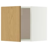 A white and light wooden METOD wall cabinet with one door slightly open, revealing glass shelves inside.