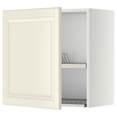 Off-white kitchen cabinet with bevelled edges, open door showing metal dish drainer, creamy, rectangular.